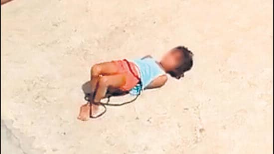 A video grab shows the girl, her hands and legs tied, on the terrace of her home in northeast Delhi’s Khajuri Khas. (Sourced)