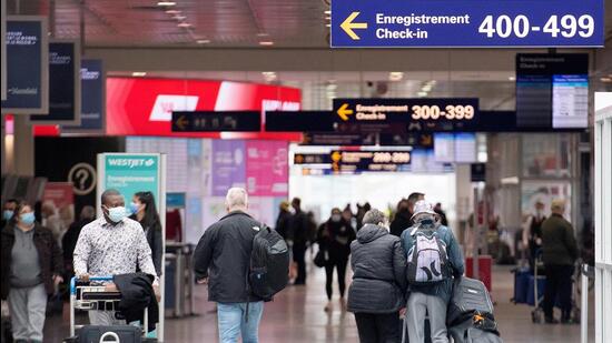 Travellers at Montreal-Pierre Elliott Trudeau International Airport in Montreal, Quebec, Canada. (Bloomberg)