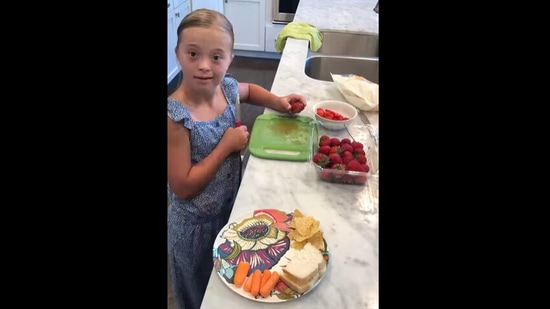 The little girl with Down Syndrome can be seen making her own lunch in this viral video.&nbsp;(Instagram/@a_little_extra_jayne)