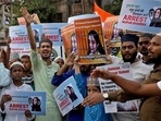 People shout slogans as they hold placards during a protest demanding the arrest of Nupur Sharma for her comments on Prophet Mohammed.&nbsp;