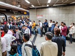 New Delhi: Commuters wait in a queue to board a metro at a platform inside Mandi House metro station on the Blue Line.