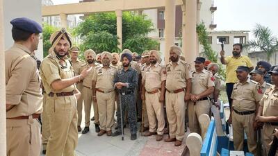 Ropar Range DIG Gurpreet Singh Bhullar briefing the police teams ahead of the search operation at three housing societies in Mohali on Thursday. (HT Photo) Ropar Range DIG Gurpreet Singh Bhullar briefing the police teams ahead of the search operation at three housing societies in Mohali on Thursday. (HT Photo)