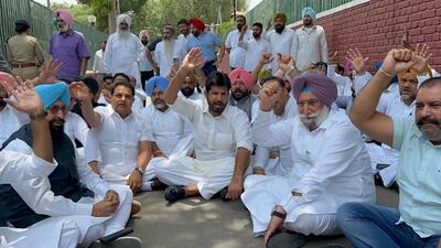 Punjab Congress leaders on Thursday started an impromptu dharna at chief minister Bhagwant Mann’s residence in Chandigarh after he refused to meet them. (HT Photo/Sanjeev Sharma)