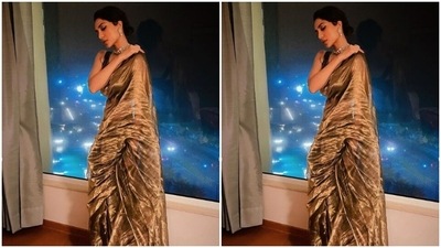 Sobhita teamed a black striped sleeveless blouse with a golden organza saree. In a diamond choker and diamond earrings, Sobhita looked ethereal. (Instagram/@sobhitad)