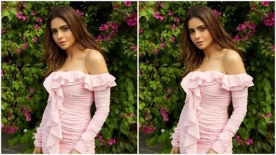 Aamna’s pastel pink short dress featured off-shoulder details lined with frills, full sleeves and pleated detail throughout the torso. (Instagram/@aamnasharifofficial)
