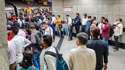 New Delhi: Commuters wait in a queue to board a metro at a platform inside Mandi House metro station on the Blue Line. (PTI) New Delhi: Commuters wait in a queue to board a metro at a platform inside Mandi House metro station on the Blue Line. (PTI)
