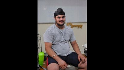 Paramvir lifted 126kg in snatch in six seconds and celebrated with a cartwheel off the stage. Later, he failed to lift 150kg in the second attempt of clean and jerk but cleared the mark in his third attempt, ensuring a bronze medal for Chandigarh. (Keshav Singh/HT)