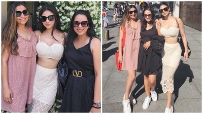 In the end, Mouni chose chunky white lace-up sneakers with a black Chanel chained tote bag to accessorise the outfit. Centre-parted open tresses, subtle smoky eye shadow, sleek eyeliner, mascara on the lashes, nude lip shade, glowing skin, and blushed cheeks rounded off the glam picks. (Instagram/@imouniroy) In the end, Mouni chose chunky white lace-up sneakers with a black Chanel chained tote bag to accessorise the outfit. Centre-parted open tresses, subtle smoky eye shadow, sleek eyeliner, mascara on the lashes, nude lip shade, glowing skin, and blushed cheeks rounded off the glam picks. (Instagram/@imouniroy)