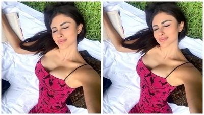 Lastly, Mouni styled the body-hugging ensemble with open tresses, subtle eye shadow, sleek winged black eyeliner, mascara-adorned lashes, glowing skin, nude lip shade and blushed cheeks. Her statement no-jewellery look gave the finishing touch to the simply chic midi dress. (Instagram/@imouniroy) Lastly, Mouni styled the body-hugging ensemble with open tresses, subtle eye shadow, sleek winged black eyeliner, mascara-adorned lashes, glowing skin, nude lip shade and blushed cheeks. Her statement no-jewellery look gave the finishing touch to the simply chic midi dress. (Instagram/@imouniroy)