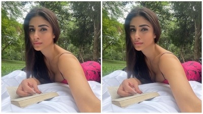 Mouni went on a sunkissed date with her husband, Suraj Nambiar. The pictures showed the Brahmastra actor chilling with Suraj amid viridescent scenery and serving looks in a maroon and black printed midi dress. It features a bodycon silhouette, strappy sleeves and a plunging neckline flaunting the star's décolletage. (Instagram/@imouniroy) Mouni went on a sunkissed date with her husband, Suraj Nambiar. The pictures showed the Brahmastra actor chilling with Suraj amid viridescent scenery and serving looks in a maroon and black printed midi dress. It features a bodycon silhouette, strappy sleeves and a plunging neckline flaunting the star's décolletage. (Instagram/@imouniroy)