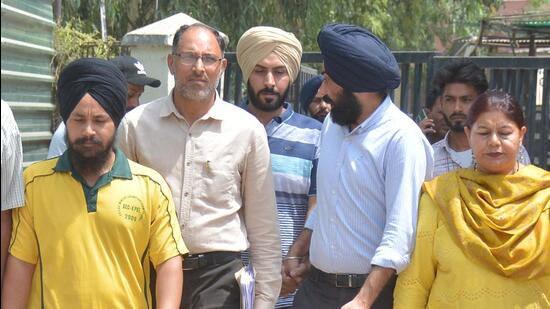The accused, Harpal Singh (centre) and Salinder Singh (left), being produced in court in Mohali on Thursday. (HT Photo)