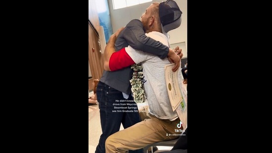 The image is taken from the Instagram and shows the son hugging his dad. (Instagram/@calibornbree)