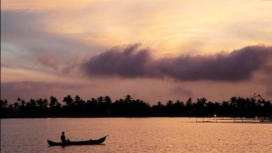 A man rows his boat in the tributary waters of Vembanad Lake on the outskirts of Kochi. (REUTERS File Photo)