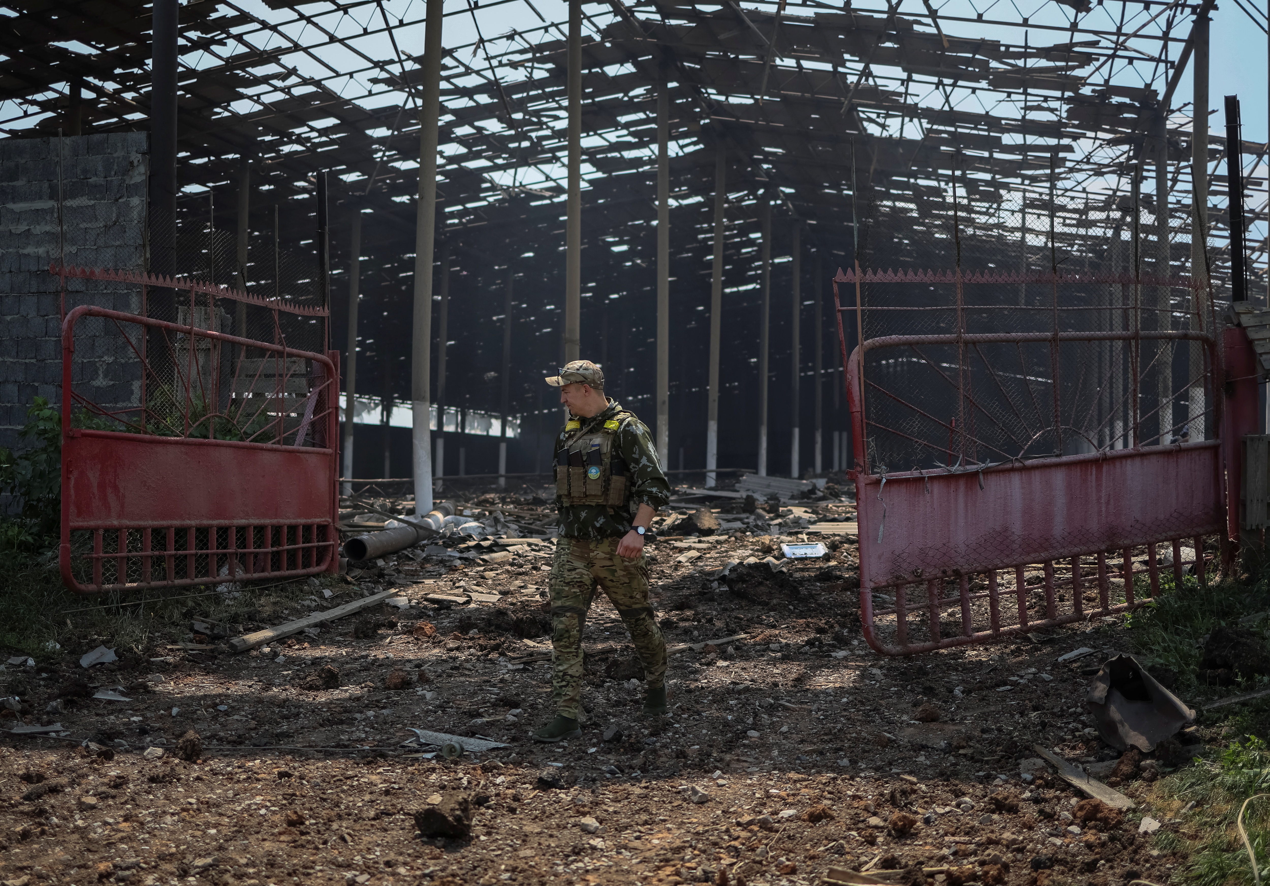 A Ukrainian serviceman walks in a destroyed grain silos after a morning shelling, amid Russia's invasion of Ukraine, near the town of Soledar, Donetsk region Ukraine on Wednesday.&nbsp; (REUTERS)
