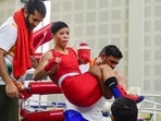 Boxer Mary Kom being taken out of the boxing ring after getting injured during her match at the Elite Women CWG Trials 2022, at Indira Gandhi stadium, in New Delhi, Friday, June 10, 2022. Boxer Mary Kom being taken out of the boxing ring after getting injured during her match at the Elite Women CWG Trials 2022, at Indira Gandhi stadium, in New Delhi, Friday, June 10, 2022.