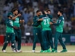 Pakistan's Mohammad Nawaz, center, celebrates with teammates after the dismissal of West Indies' Rovman Powell during the second one-day international cricket match between Pakistan and West Indies at the Multan Cricket Stadium, in Multan