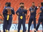 India players celebrate the dismissal of England player Jason Roy