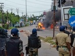 Security personnel try to maintain law and order as a vehicle is allegedly set ablaze by miscreants during a protest over controversial remarks on Prophet Mohammed, in West Bengal's Howrah district on Friday, June 10, 2022. (PTI Photo) Security personnel try to maintain law and order as a vehicle is allegedly set ablaze by miscreants during a protest over controversial remarks on Prophet Mohammed, in West Bengal's Howrah district on Friday, June 10, 2022. (PTI Photo)