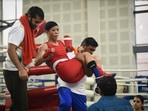 Mary Kom being carried off the ring