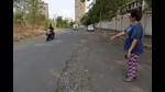 A resident points at the poor road condition in Kharghar. Abysmal electoral representation is considered the main reason for poor development of certain nodes, says KTCWA. (BACHCHAN KUMAR/HT PHOTO) A resident points at the poor road condition in Kharghar. Abysmal electoral representation is considered the main reason for poor development of certain nodes, says KTCWA. (BACHCHAN KUMAR/HT PHOTO)