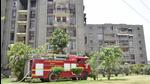 Ludhiana In the absence of hydraulic ladders, firefighters were seen struggling to douse the blaze that broke out at the Swami Vivekanand Vihar Flats in BRS Nagar on Thursday afternoon. (Harvinder Singh/HT)