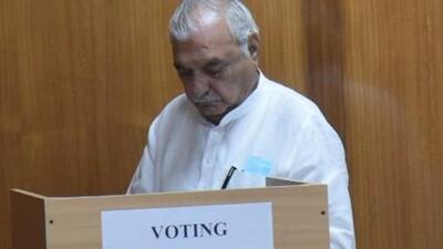 Former Haryana CM Bhupinder Singh Hooda casts his ballot during the Rajya Sabha elections in the state. (Keshav Singh/ HT Photo)