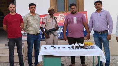 The cyber cell of the police department with the accused after the call centre bust on Thursday. (Delhi Police) The cyber cell of the police department with the accused after the call centre bust on Thursday. (Delhi Police)