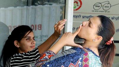 Gurugram, June 09 (ANI): A healthcare worker collects a nasal swab sample of a woman for COVID-19 testing, in Gurugram on Thursday. (ANI Photo) (Yogendra Kumar) Gurugram, June 09 (ANI): A healthcare worker collects a nasal swab sample of a woman for COVID-19 testing, in Gurugram on Thursday. (ANI Photo) (Yogendra Kumar)
