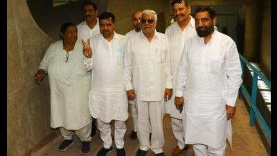 Congress MLAs on their way to the Haryana Vidhan Sabha to exercise their franchise in the Rajya Sabha elections, in Chandigarh on Friday. (Keshav Singh/HT)