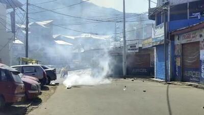 Doda: Smoke rises from a tear gas shell used by security forces to disperse a mob which gathered despite curfew in Bhaderwah town of Doda district on Friday (PTI) Doda: Smoke rises from a tear gas shell used by security forces to disperse a mob which gathered despite curfew in Bhaderwah town of Doda district on Friday (PTI)