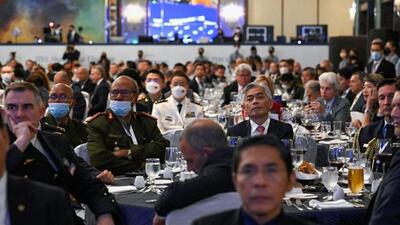 Delegates listen to the opening address given by Japan's Prime Minister Fumio Kishida at the opening dinner of the 19th Shangri-La Dialogue in Singapore. (REUTERS)