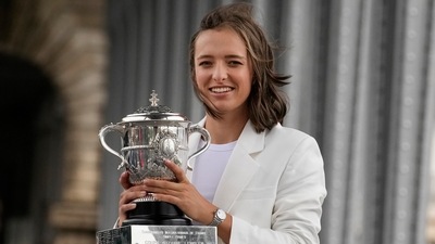 Poland's Iga Swiatek poses with the French Open trophy in Paris. (AP)