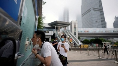 A man has a swab collected at a nucleic acid testing site in Lujiazui financial district, after the lockdown placed to curb the coronavirus disease (Covid-19) outbreak was lifted in Shanghai, China. (REUTERS)