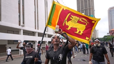 A protester washes his eyes to avoid tear gas effect during a protest outside police head quarters in Colombo, Sri Lanka. (AP) A protester washes his eyes to avoid tear gas effect during a protest outside police head quarters in Colombo, Sri Lanka. (AP)