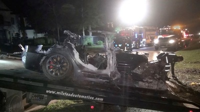 FILE PHOTO: The remains of a Tesla vehicle are seen after it crashed in The Woodlands, Texas. (via Reuters)