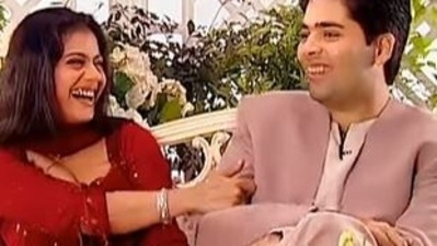 Kajol and Karan Johar laugh as they talk on Simi Garewal's chat show.