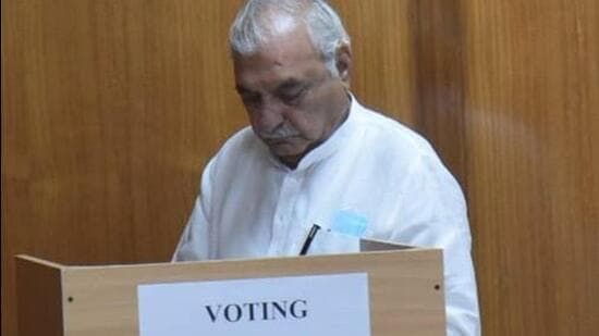 Former Haryana CM Bhupinder Singh Hooda casts his ballot during the Rajya Sabha elections in the state. (Keshav Singh/ HT Photo)