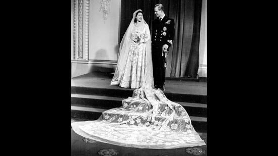 Created by British designer, Norman Hartnell, this traditional wedding gown features a dramatic train embroidered with duchess satin, ivory silk and silver thread with pearls and crystals.  (Photo: AFP, Facebook, Instagram and Twitter)