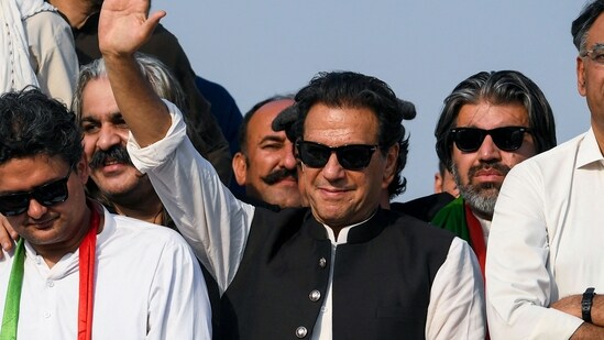 Ousted Pakistan's prime minister Imran Khan waves at his party supporters during a rally in Islamabad.(AFP / File)