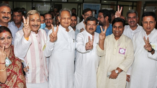 Rajasthan Chief Minister Ashok Gehlot with the Congress candidates and others flashes the victory sign during the Rajya Sabha election in Jaipur, on Friday.&nbsp;(PTI)