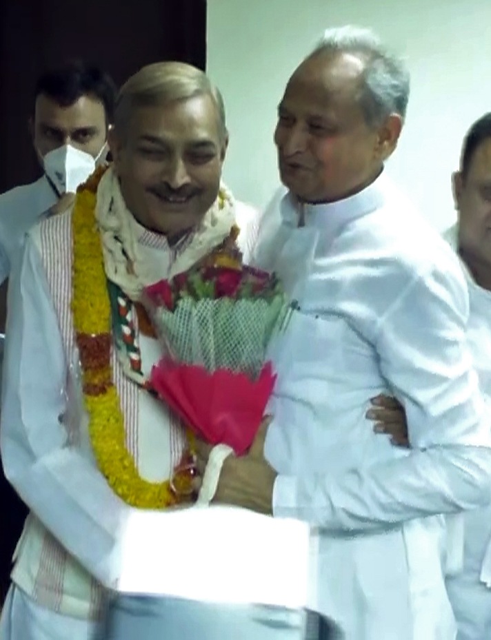 Rajasthan Chief Minister Ashok Gehlot congratulates Congress candidate Pramod Tiwari as he won the Rajya Sabha elections from Rajasthan, in Jaipur on Friday. (ANI) Rajasthan Chief Minister Ashok Gehlot congratulates Congress candidate Pramod Tiwari as he won the Rajya Sabha elections from Rajasthan, in Jaipur on Friday. (ANI)
