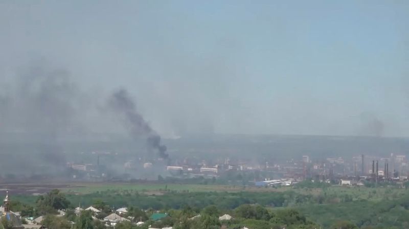 Black smoke billows over Sievierodonetsk as Russia's invasion on Ukraine continues, in this still image obtained from a handout video released on June 9, 2022. (via REUTERS)