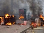 Flames and smoke rise from vehicles on fire, that were allegedly set ablaze by miscreants during a protest in Howrah.(PTI) Flames and smoke rise from vehicles on fire, that were allegedly set ablaze by miscreants during a protest in Howrah.(PTI)