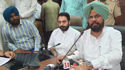 Punjab rural development and panchayat minister Kuldip Singh Dhaliwal (R) addresses a press conference in Amritsar on Saturday. (Sameer Sehgal /HT) Punjab rural development and panchayat minister Kuldip Singh Dhaliwal (R) addresses a press conference in Amritsar on Saturday. (Sameer Sehgal /HT)