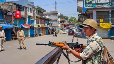 Security personnel stand guard at Mendhar in Poonch district on Saturday. (PTI) Security personnel stand guard at Mendhar in Poonch district on Saturday. (PTI)