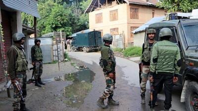 Security personnel stand guard at a site where an encounter between militants and security forces took place, at Khandipora, in Kulgam on Saturday. (ANI Photo) Security personnel stand guard at a site where an encounter between militants and security forces took place, at Khandipora, in Kulgam on Saturday. (ANI Photo)