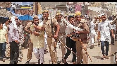 Police attempt to detain protestors during a demonstration in Saharanpur, on Friday. (Agency) Police attempt to detain protestors during a demonstration in Saharanpur, on Friday. (Agency)