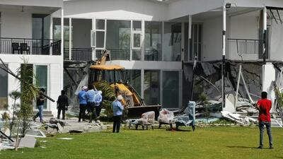 A farmhouse built on Yamuna floodplains being razed on Saturday. (Sourced)