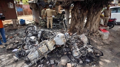 Charred remains of police vehicles, a day after clashes in Prayagraj, (PTI) Charred remains of police vehicles, a day after clashes in Prayagraj, (PTI)