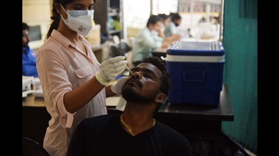 A person being tested for Covid in Navi Mumbai. With Covid cases above 200, the NMMC has restarted its war room. (BACHCHAN KUMAR/HT PHOTO)